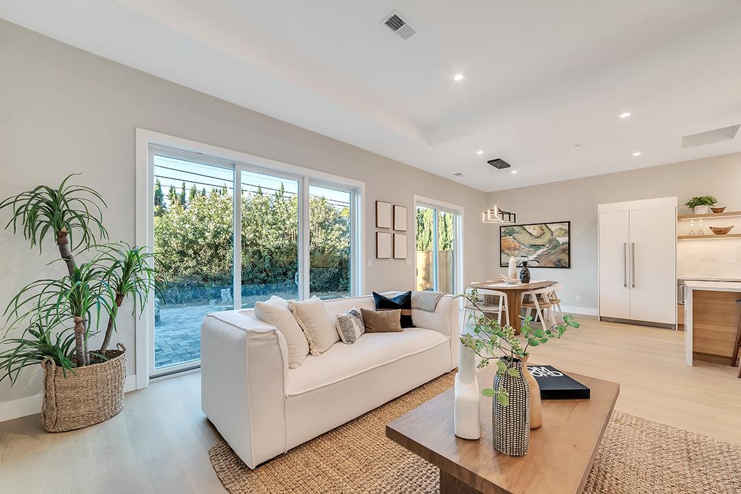 10872 West Estates Drive Cupertino, CA 95014 - Photo 27 of 58 a living room with furniture potted plant and a window