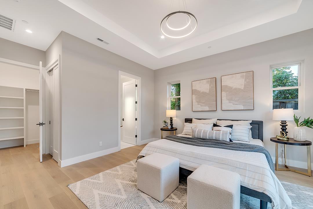 10872 West Estates Drive Cupertino, CA 95014 - Photo 33 of 58 a bedroom with a large bed and windows