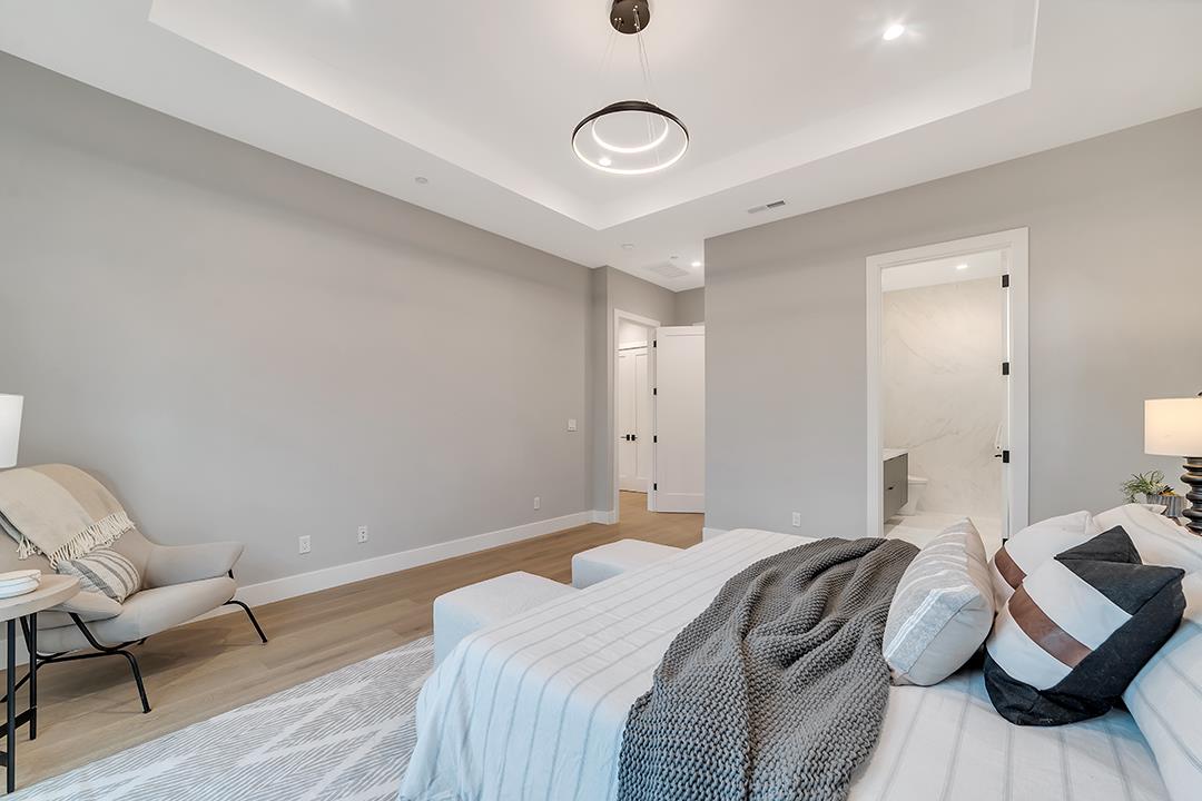 10872 West Estates Drive Cupertino, CA 95014 - Photo 34 of 58 a bedroom with a bed and wooden floor