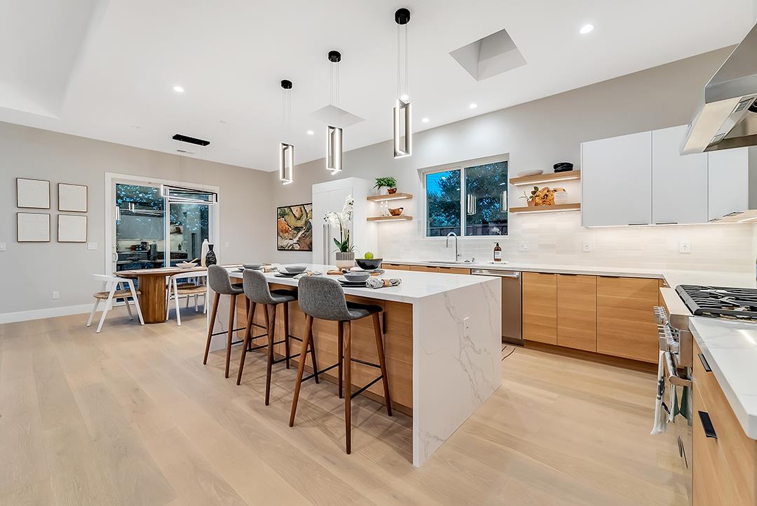 10872 West Estates Drive Cupertino, CA 95014 - Photo 49 of 58 a kitchen with stainless steel appliances kitchen island granite countertop a sink and cabinets