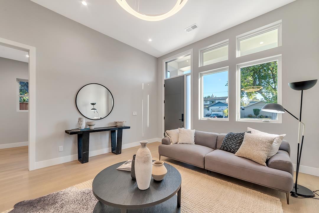 10872 West Estates Drive Cupertino, CA 95014 - Photo 6 of 58 a living room with furniture a large window and wooden floor