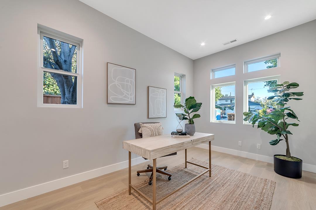 10872 West Estates Drive Cupertino, CA 95014 - Photo 8 of 58 a view of a workspace with furniture and a potted plant