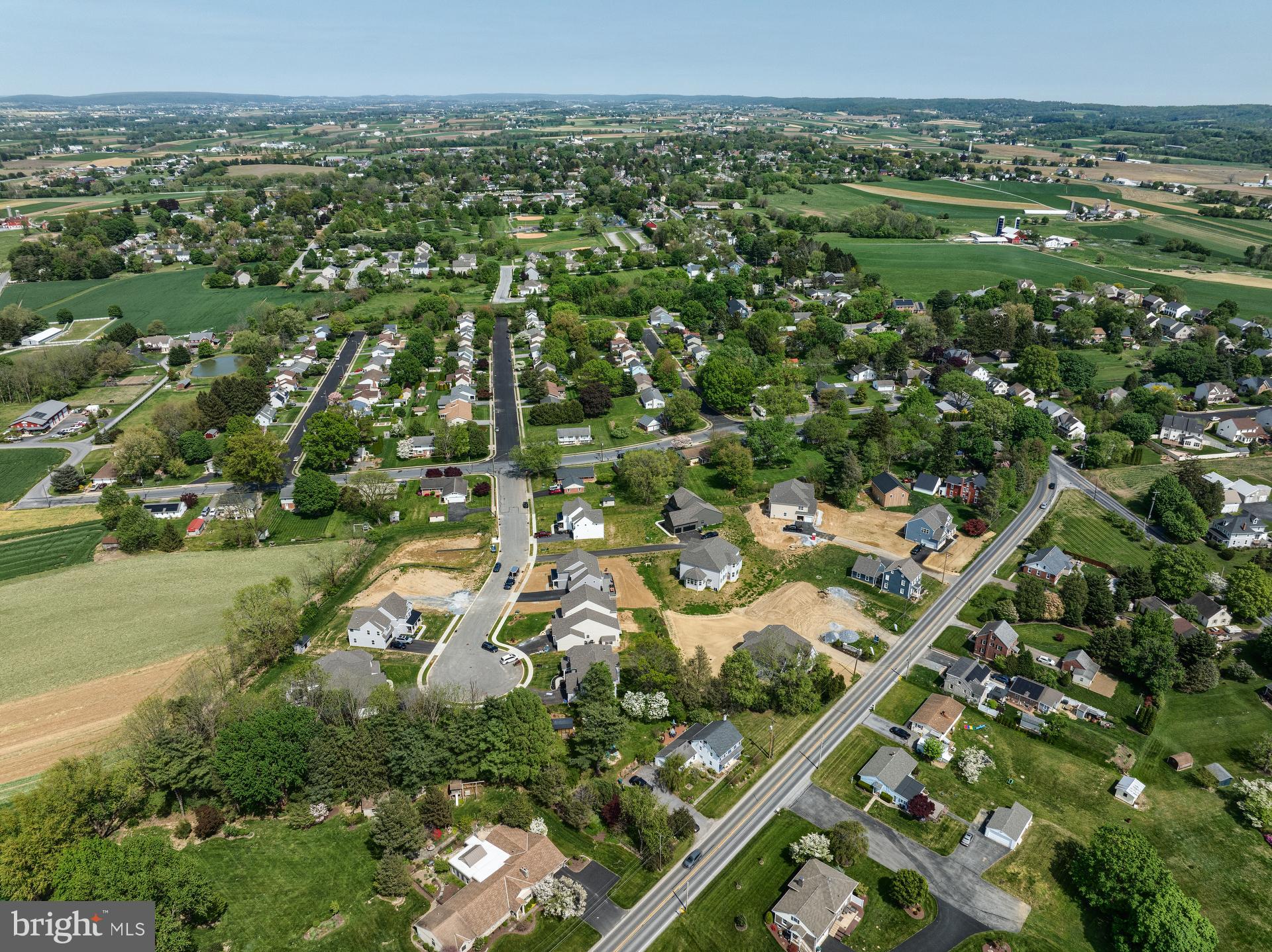 350 Village Road, Unit ARCADIA Strasburg, PA 17579 - Photo 18 of 19 an aerial view of residential houses with outdoor space and trees