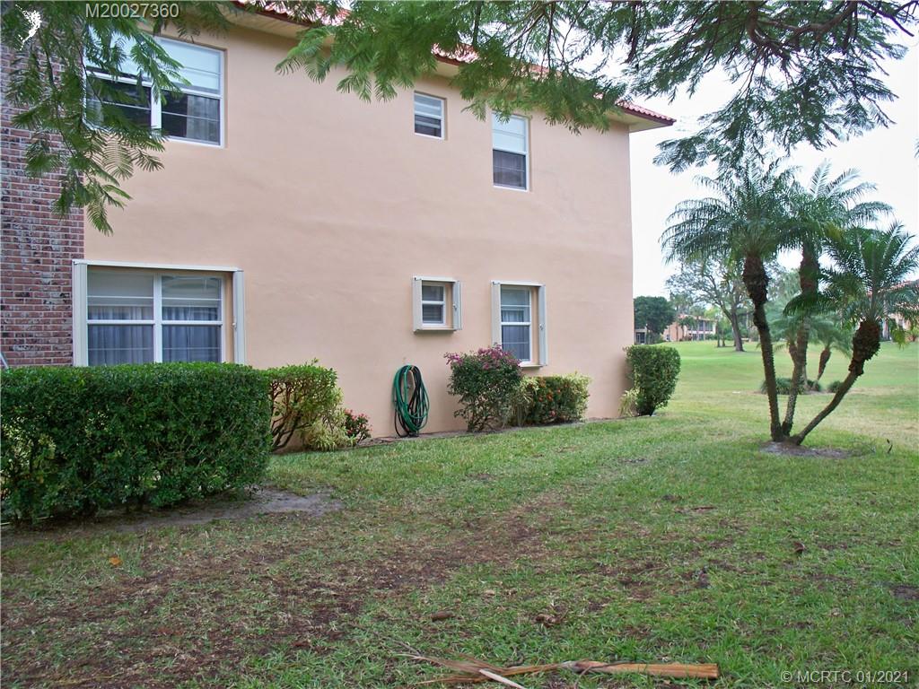 1939 Southwest Palm City Road, Unit 20E Stuart, FL 34994 - Photo 31 of 32 Side of the unit. You can see the accordion shutters
