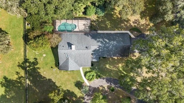 a view of a field with an trees