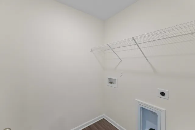 a view of a room with white walls