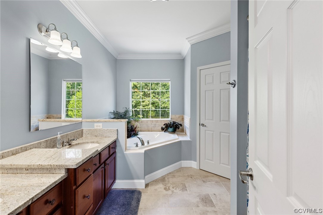 12811 Riverway Road Chesterfield, VA 23838 - Photo 23 of 50 a bathroom with a sink double vanity granite tub and a mirror