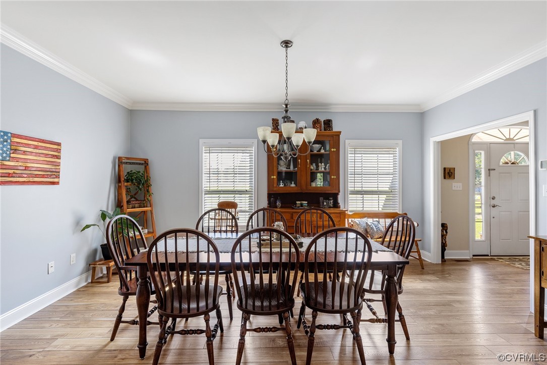 12811 Riverway Road Chesterfield, VA 23838 - Photo 8 of 50 a view of a dining room with furniture and wooden floor