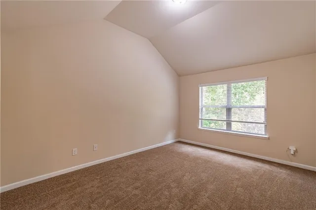 an empty room with closet area