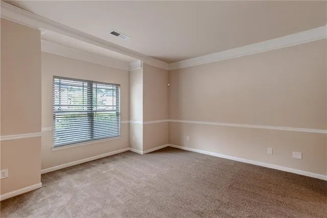 an empty room with a empty space and windows