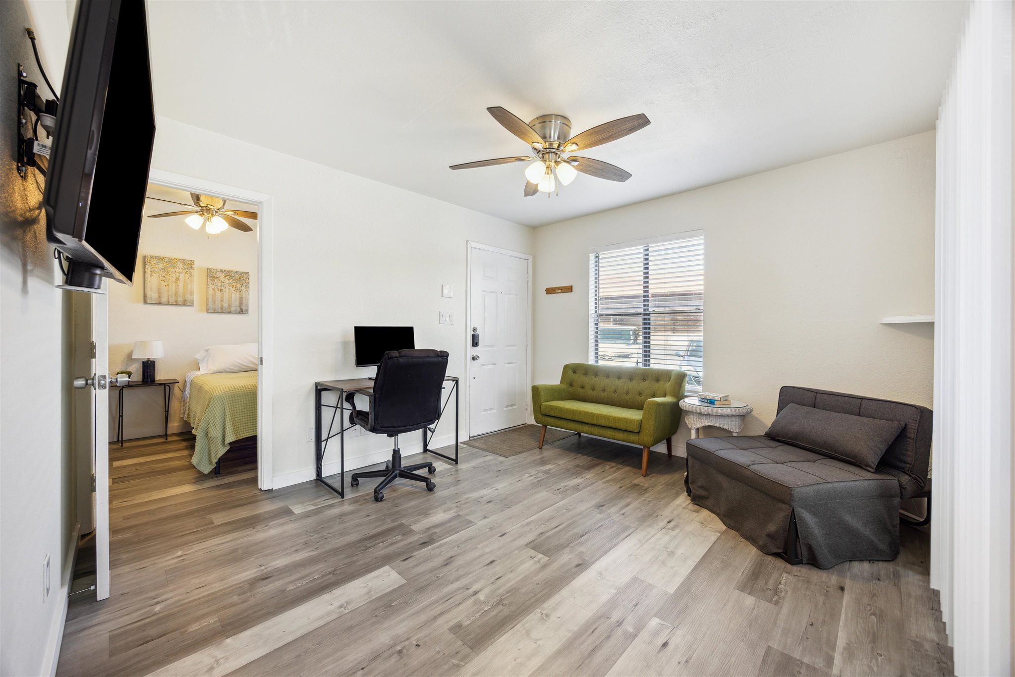 2500 Burleson Road, Unit 200 Austin, TX 78741 - Photo 4 of 12 a living room with furniture and a flat screen tv