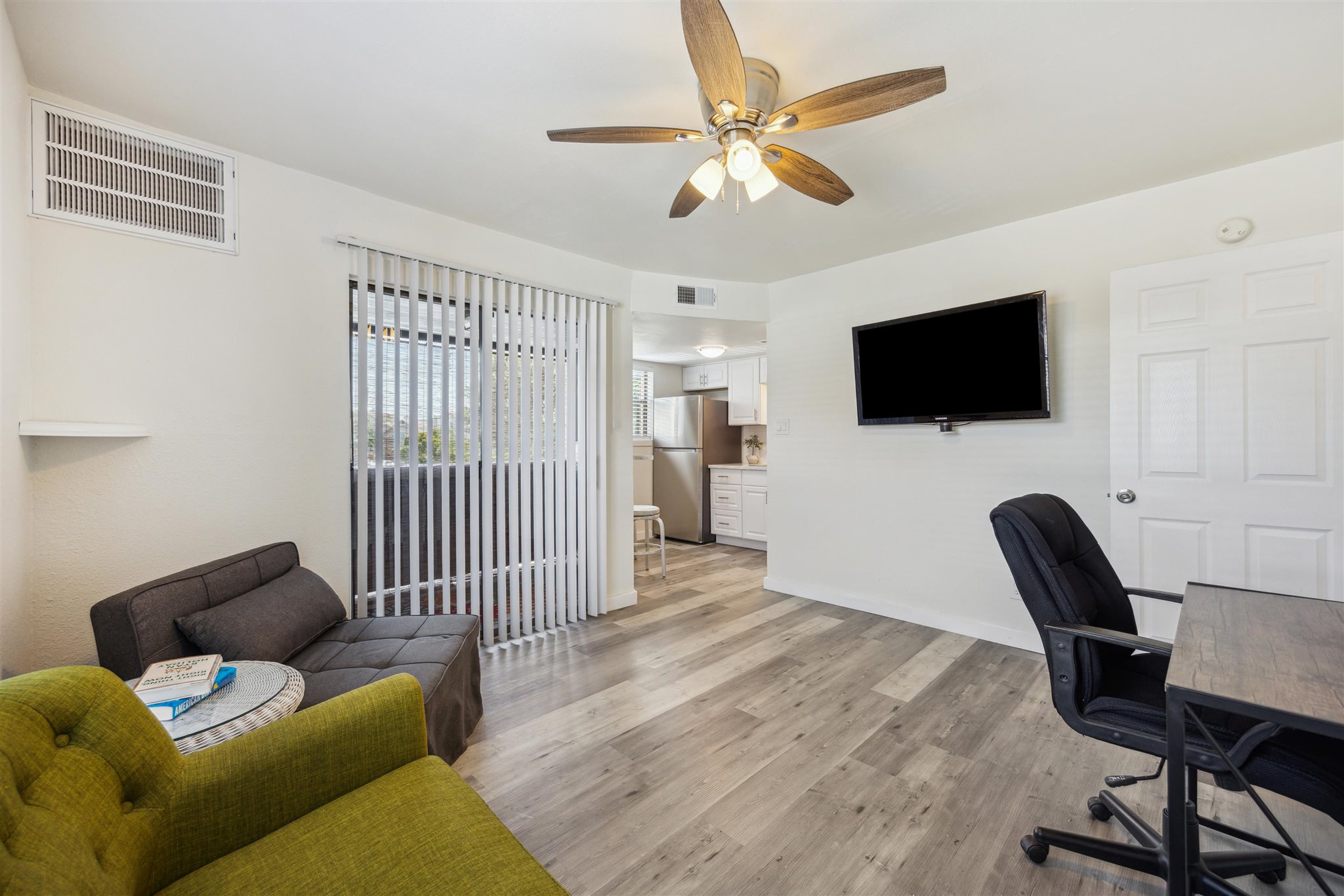 2500 Burleson Road, Unit 200 Austin, TX 78741 - Photo 5 of 12 a living room with furniture and a flat screen tv