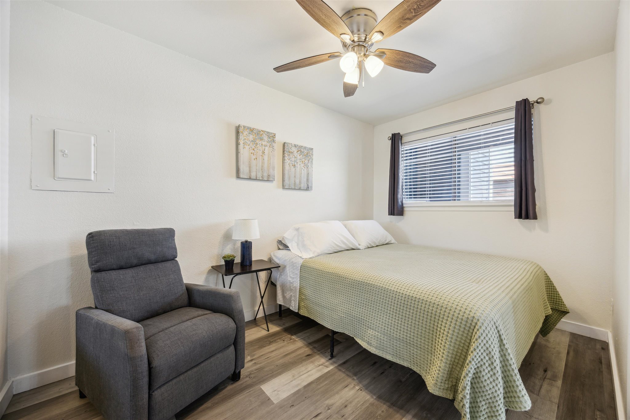 2500 Burleson Road, Unit 200 Austin, TX 78741 - Photo 8 of 12 a bedroom with a bed couches and window