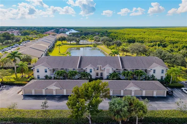 an aerial view of house with yard swimming pool and outdoor seating