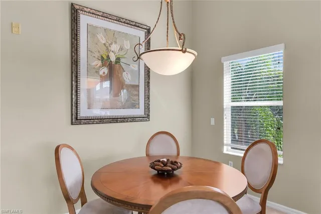 a dining room with furniture and window