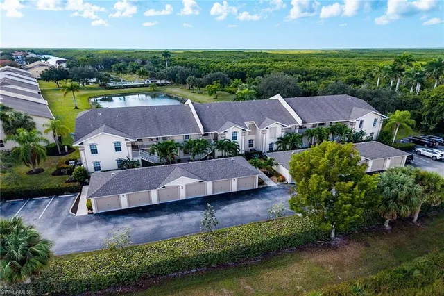 an aerial view of house with yard swimming pool and outdoor seating