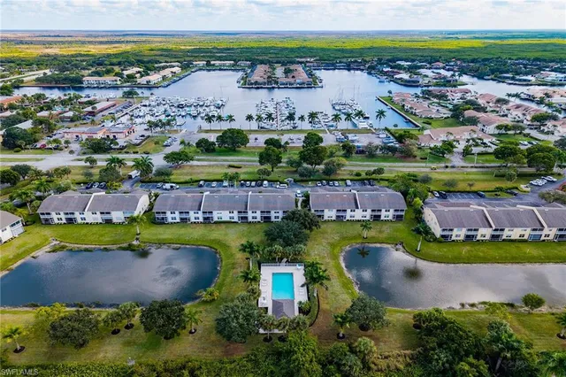 an aerial view of a house with outdoor space and pool