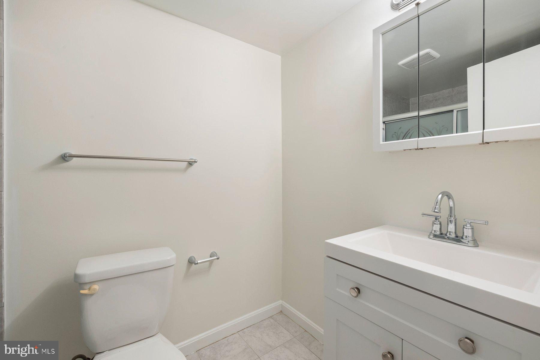 3946 Bel Pre Road, Unit 39466 Silver Spring, MD 20906 - Photo 14 of 27 a bathroom with a sink and a toilet