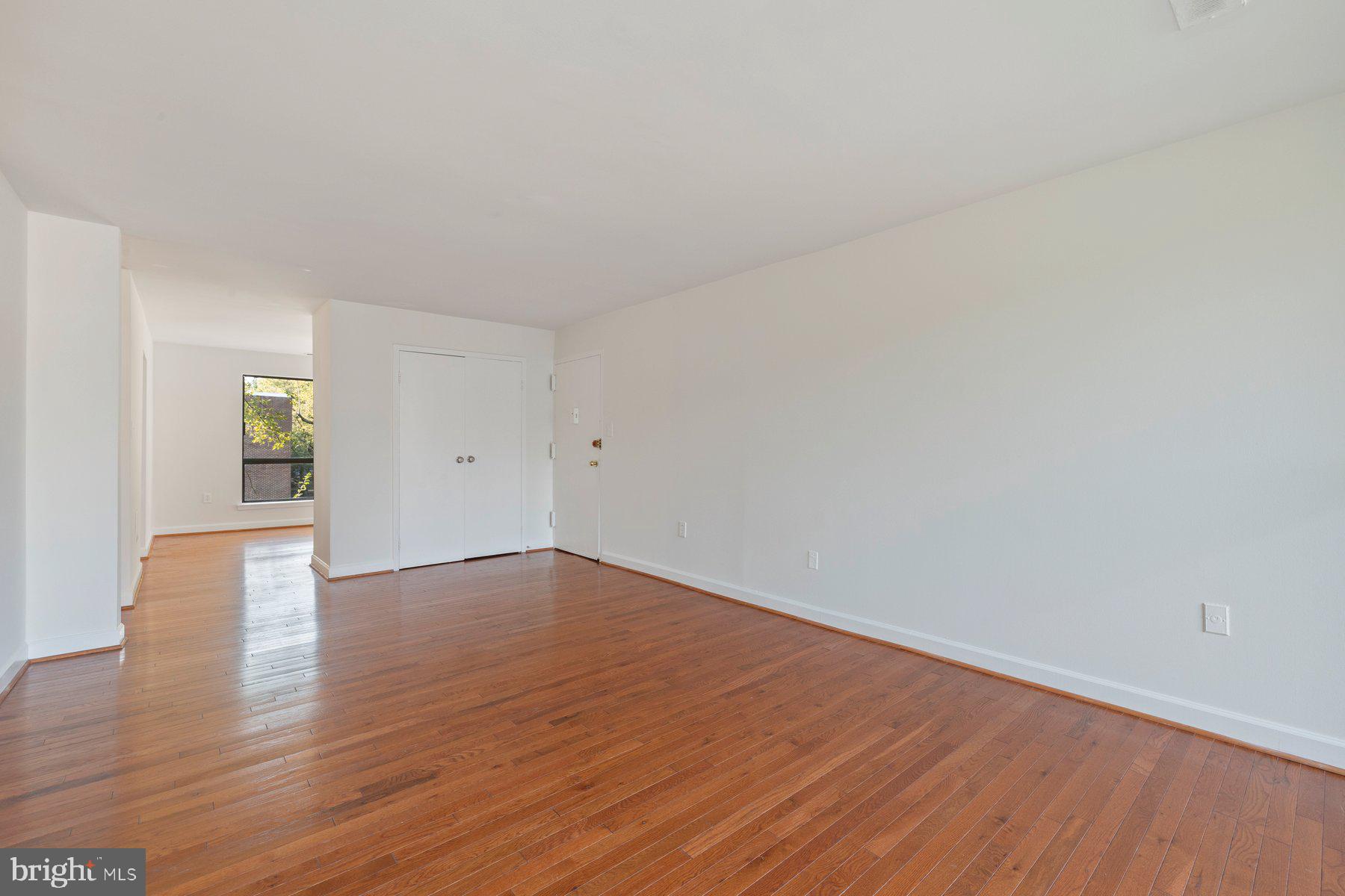 3946 Bel Pre Road, Unit 39466 Silver Spring, MD 20906 - Photo 5 of 27 a view of an empty room and wooden floor