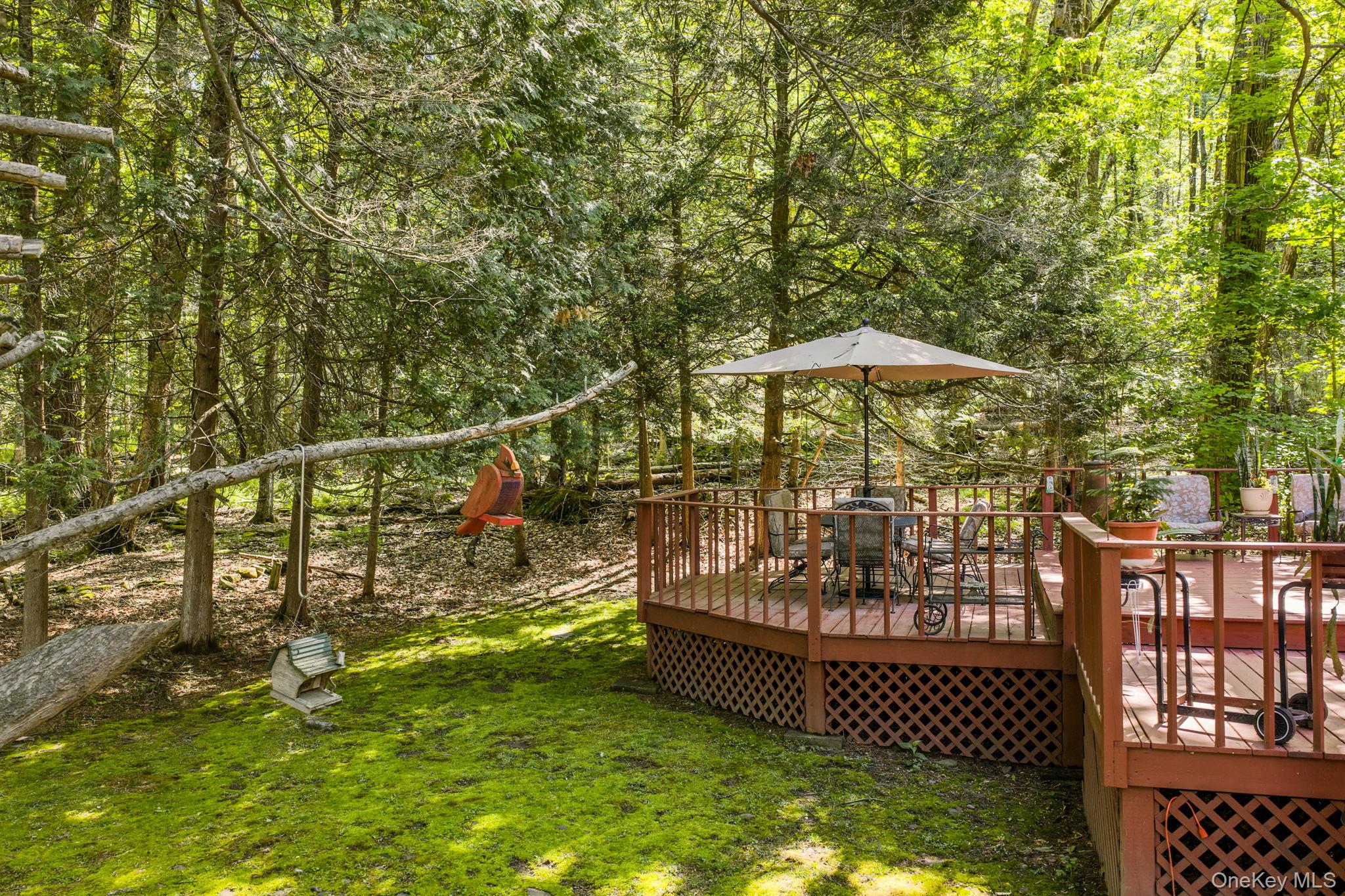 370 Starlight Road Monticello, NY 12701 - Photo 41 of 49 a view of a small yard with wooden fence
