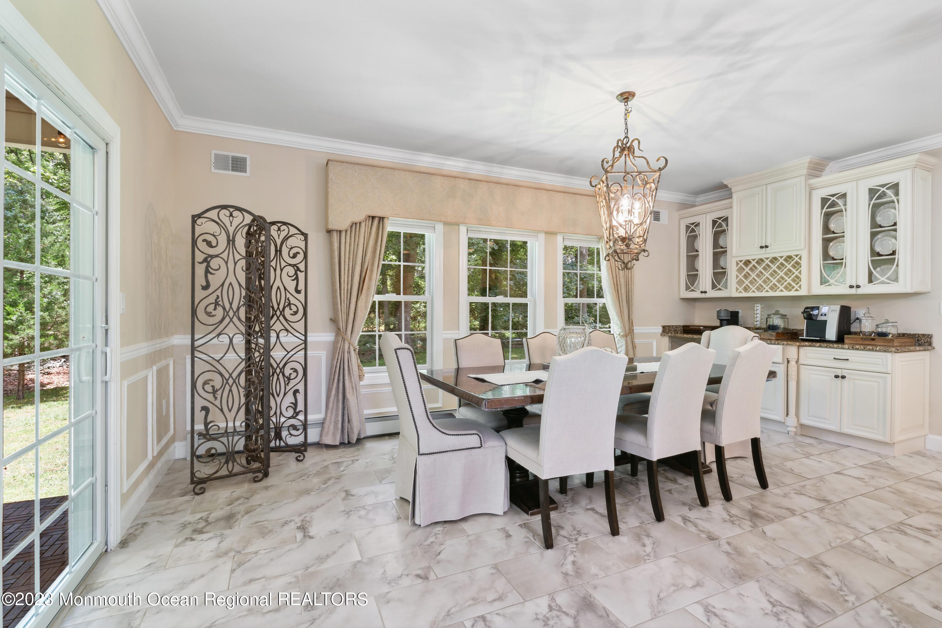 70 Bates Road Jackson, NJ 08527 - Photo 11 of 33 a view of a dining room with furniture and chandelier