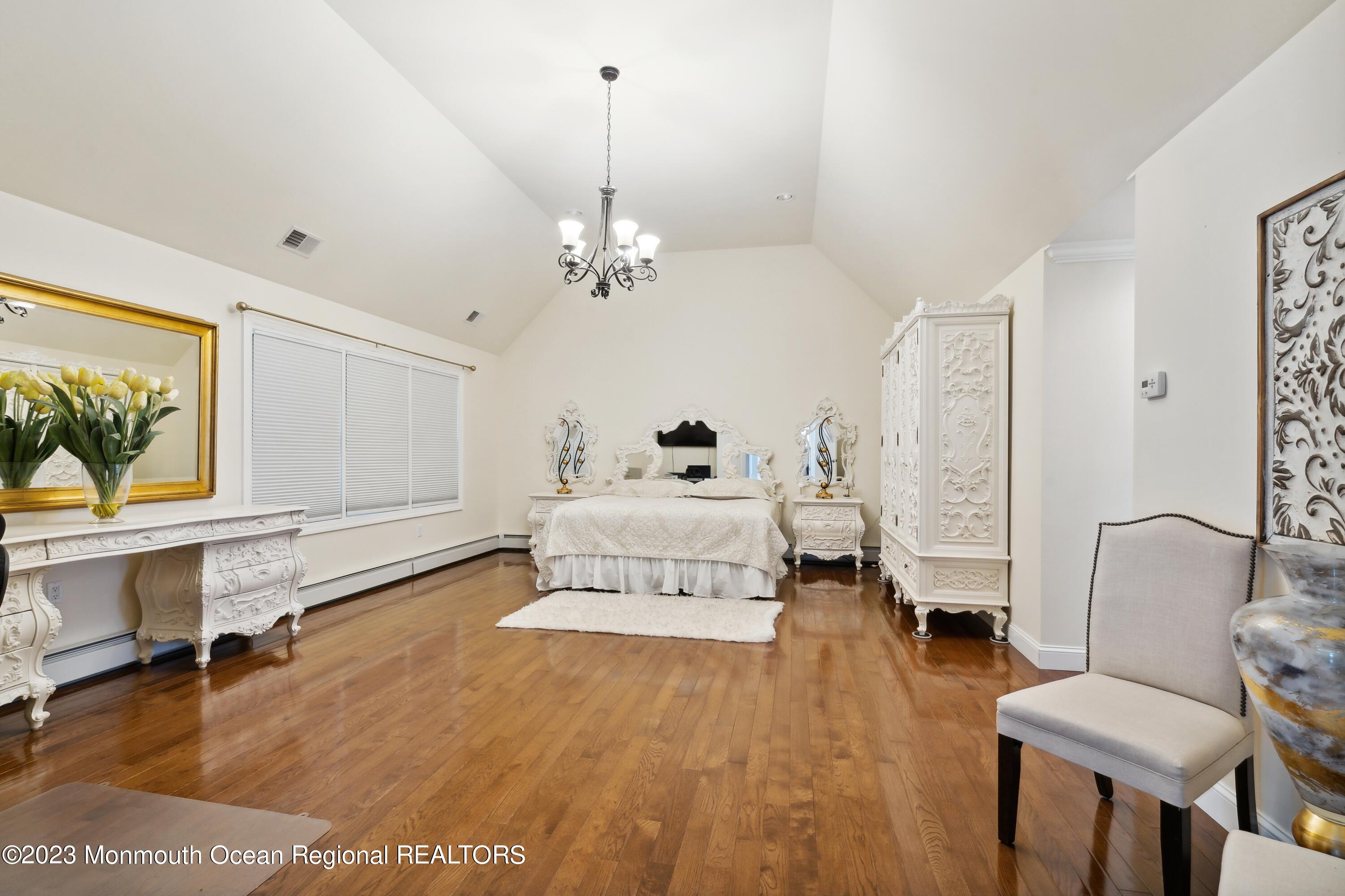 70 Bates Road Jackson, NJ 08527 - Photo 17 of 33 a living room with furniture and a wooden floor