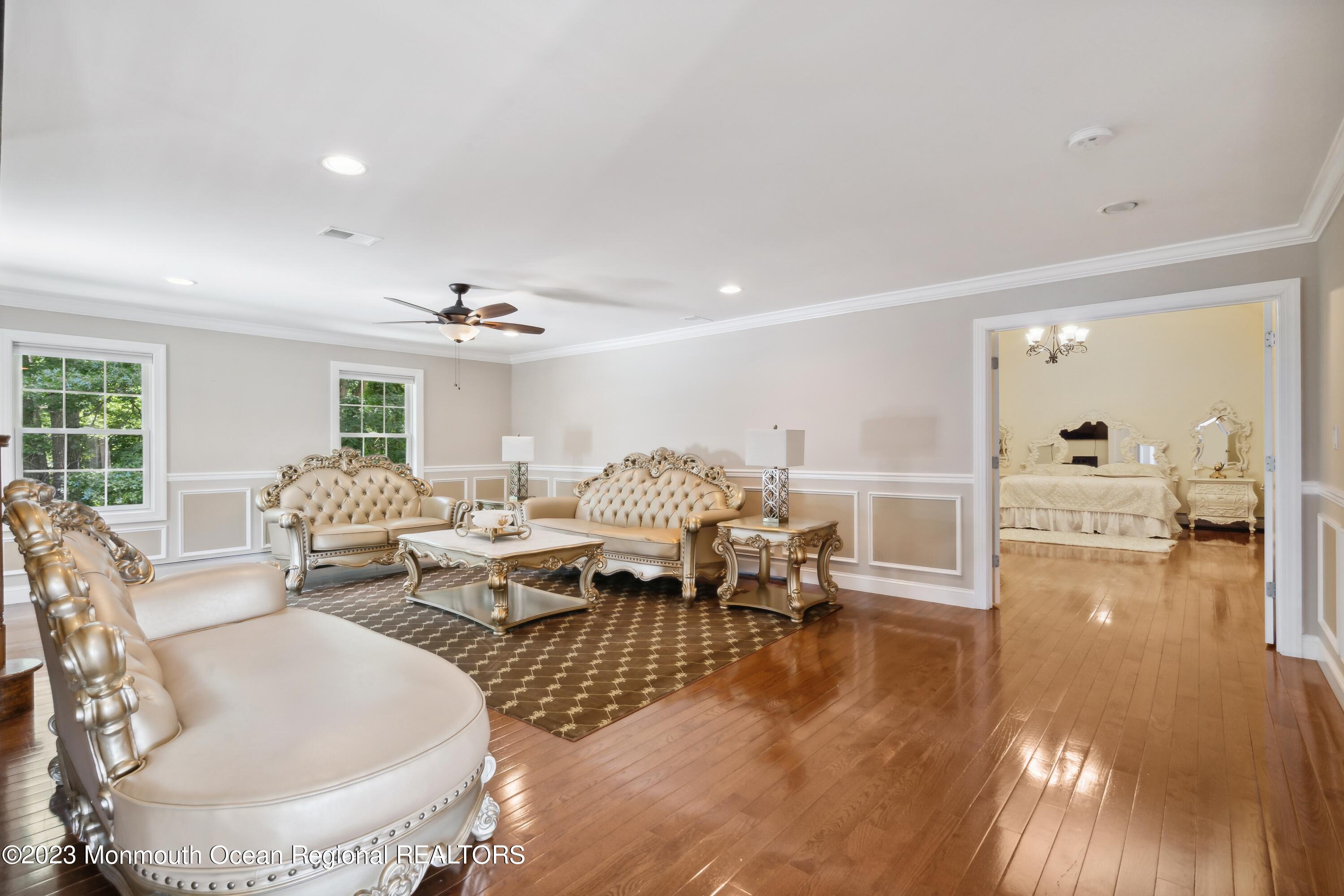 70 Bates Road Jackson, NJ 08527 - Photo 2 of 33 a living room with lots of furniture and a chandelier