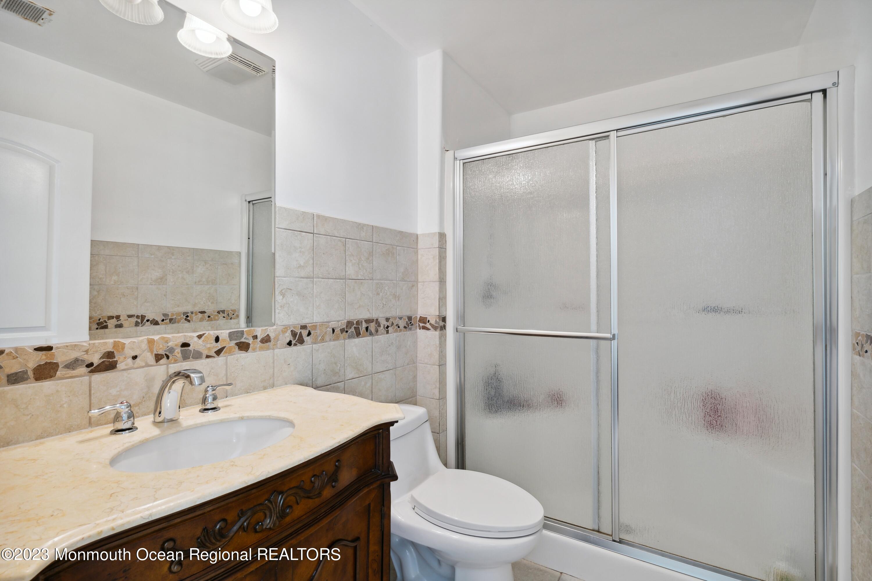 70 Bates Road Jackson, NJ 08527 - Photo 21 of 33 a bathroom with a sink toilet and shower