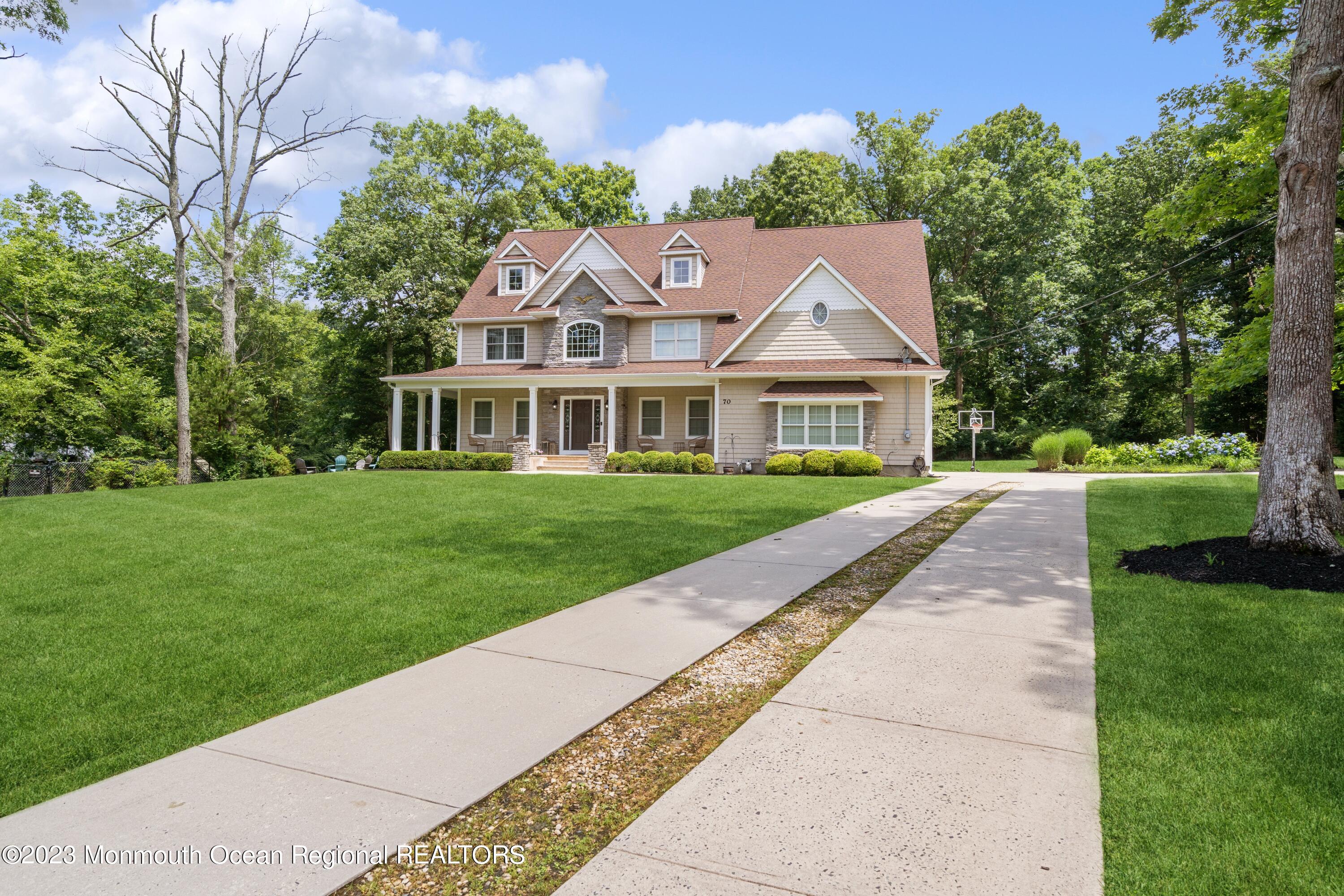 70 Bates Road Jackson, NJ 08527 - Photo 29 of 33 a front view of a house with a yard