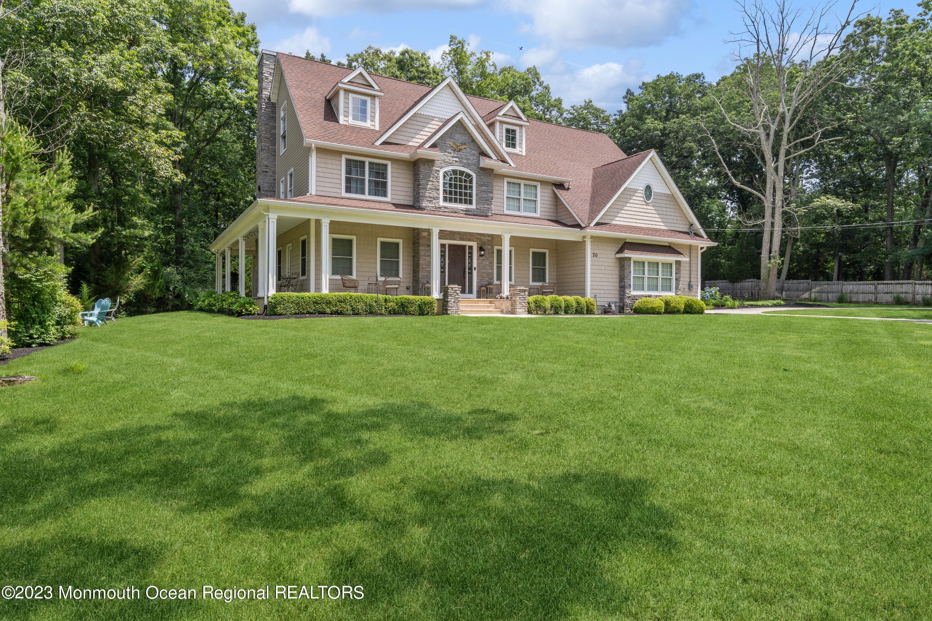 70 Bates Road Jackson, NJ 08527 - Photo 30 of 33 a front view of a house with a garden