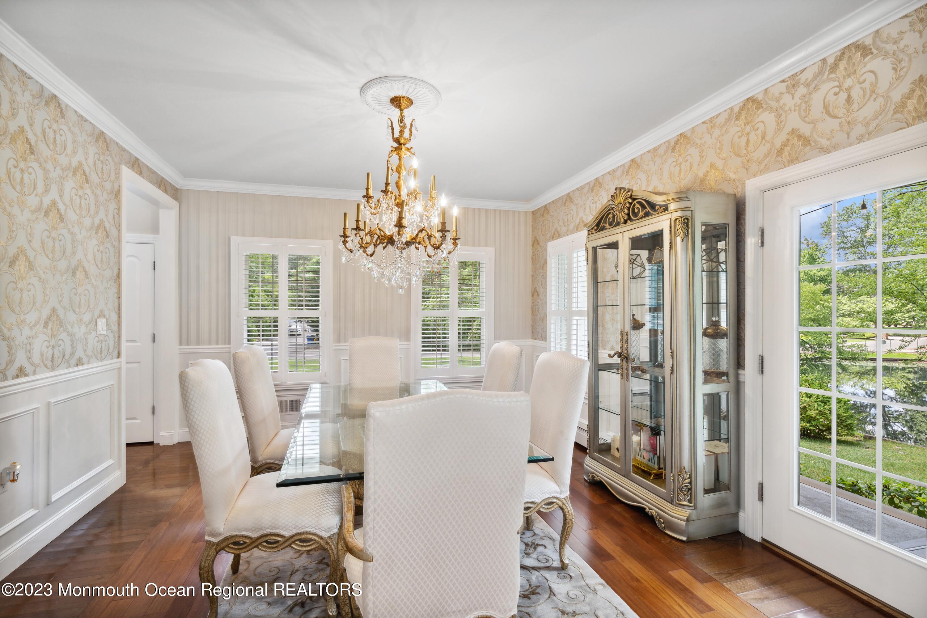 70 Bates Road Jackson, NJ 08527 - Photo 10 of 33 a living room with furniture and a chandelier