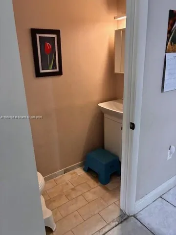 a kitchen with a sink and a stove top oven