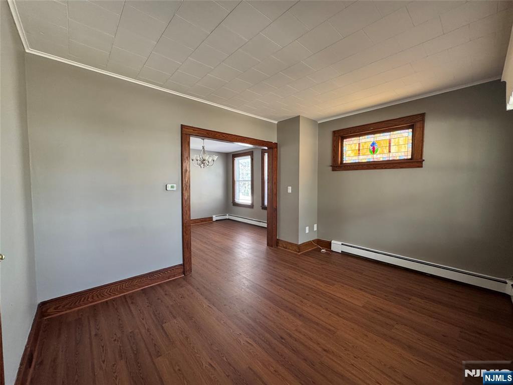 138 Carlton Avenue East Rutherford, NJ 07073 - Photo 8 of 14 an empty room with wooden floor and windows