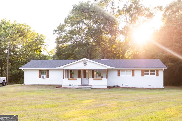 a front view of a house with swimming pool