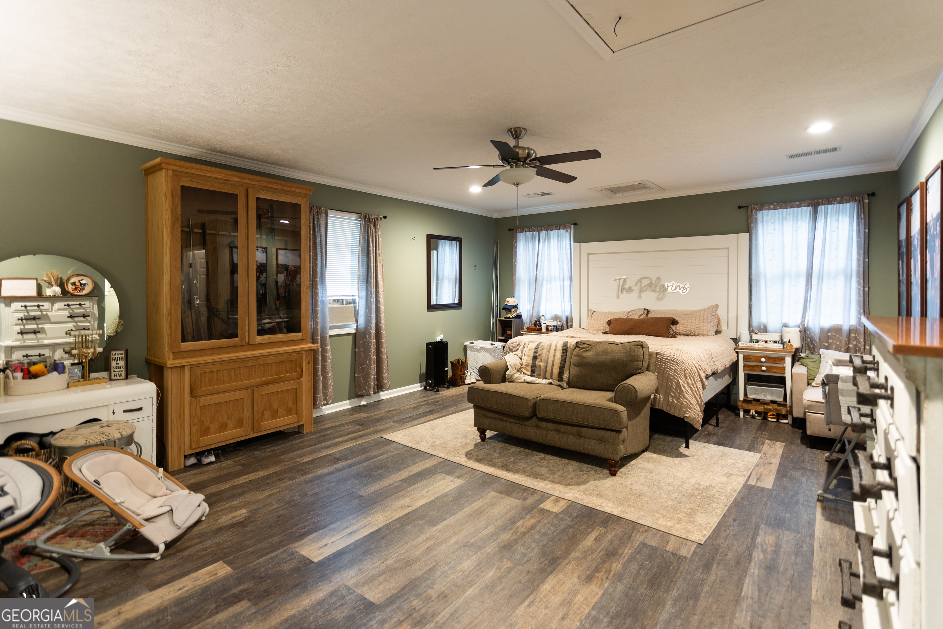 1585 Flat Rock Road Covington, GA 30014 - Photo 16 of 48 a living room with furniture two window and a wooden floor