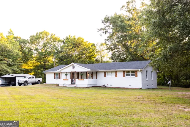 a swimming pool with buildings in the background