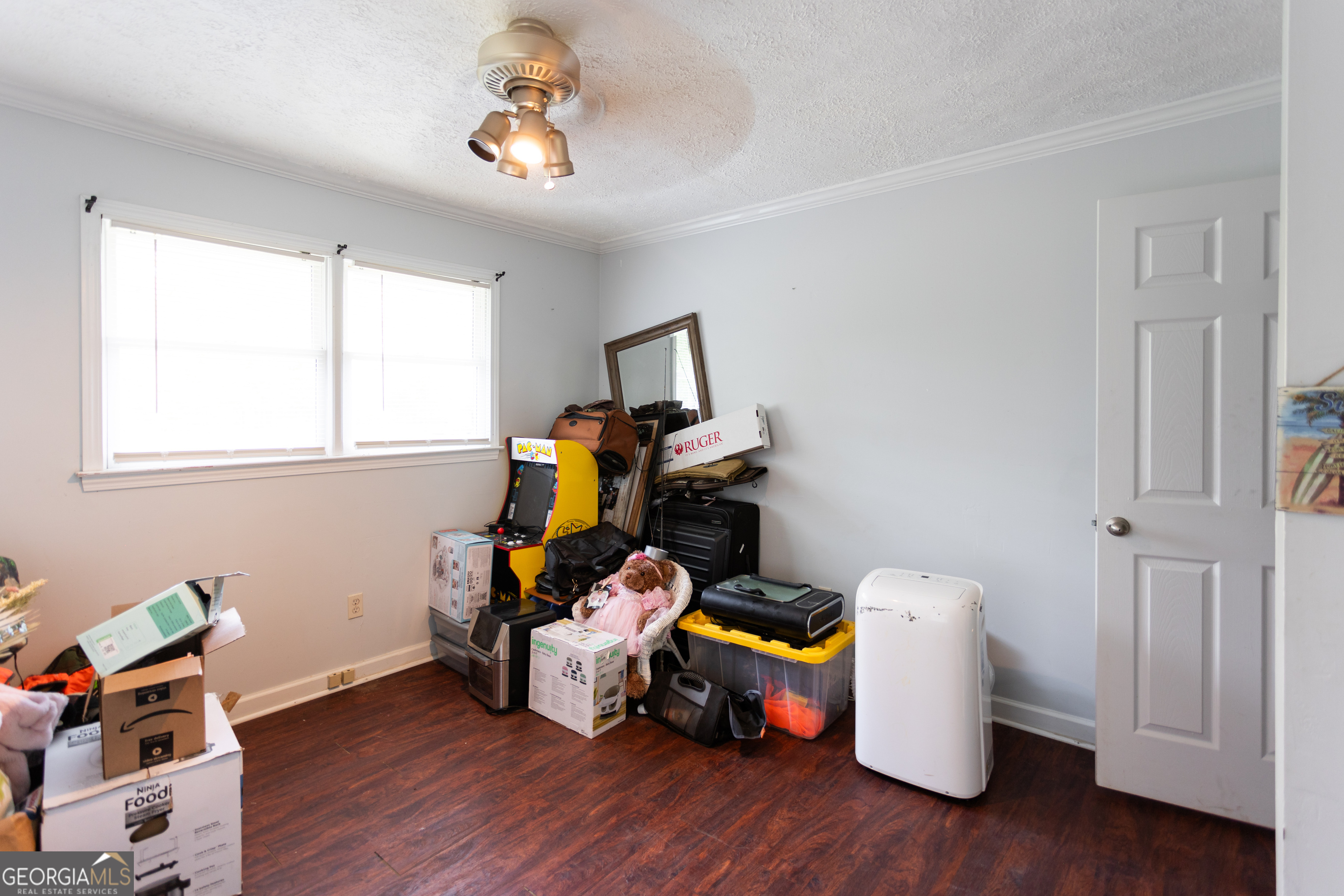 1585 Flat Rock Road Covington, GA 30014 - Photo 21 of 48 a room with furniture and wooden floor
