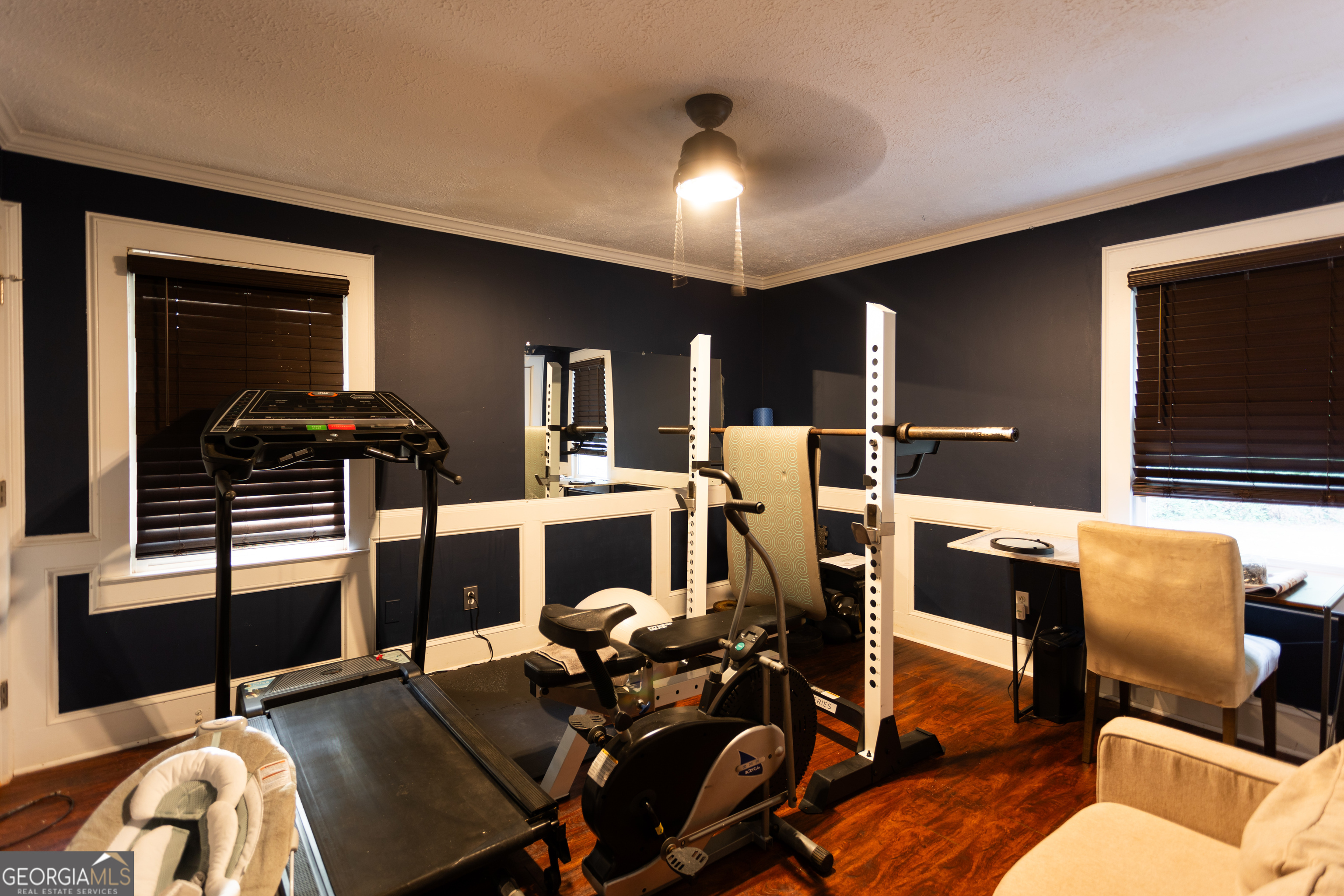 1585 Flat Rock Road Covington, GA 30014 - Photo 23 of 48 a workspace with furniture and wooden floor