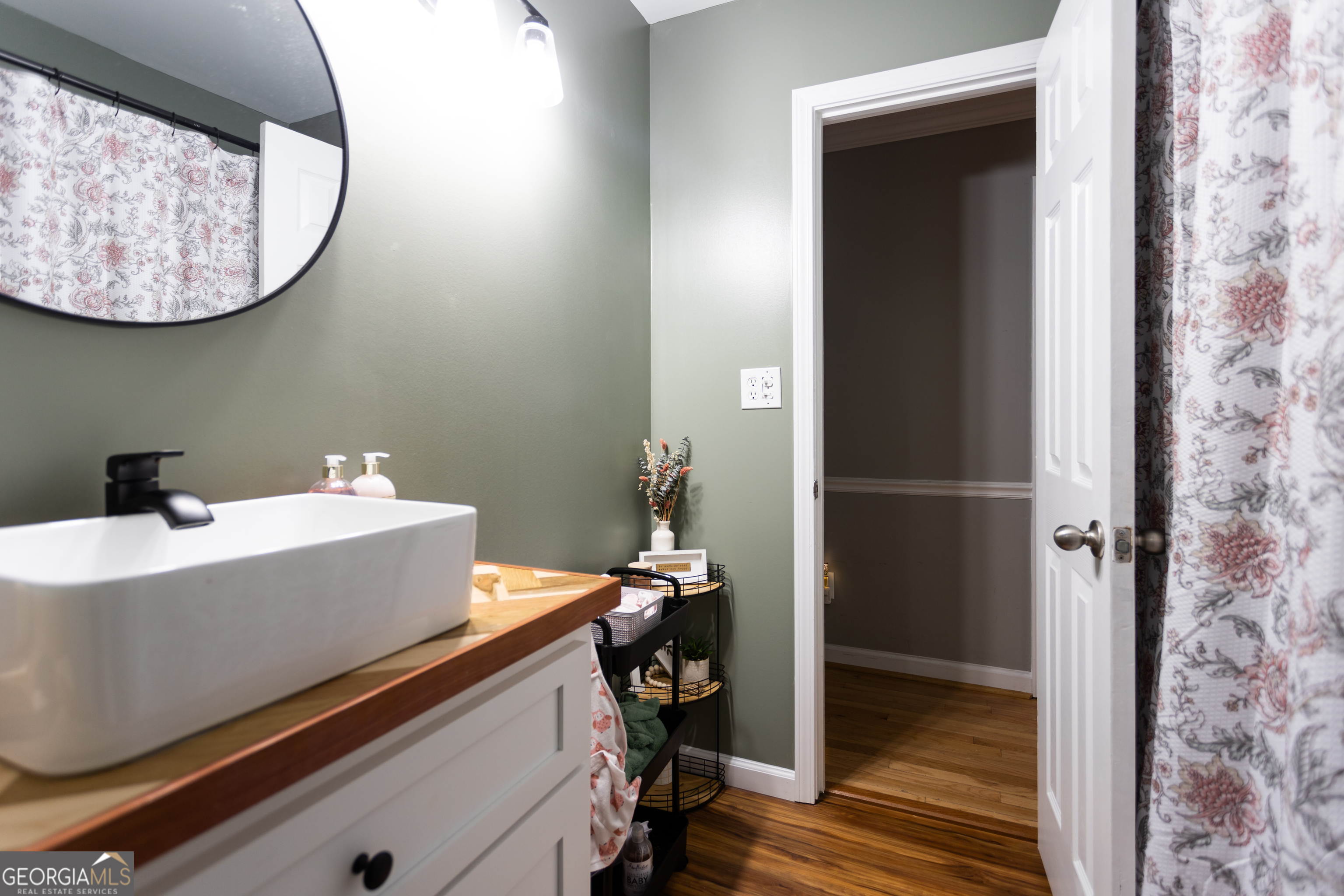 1585 Flat Rock Road Covington, GA 30014 - Photo 26 of 48 a bathroom with a sink and a mirror