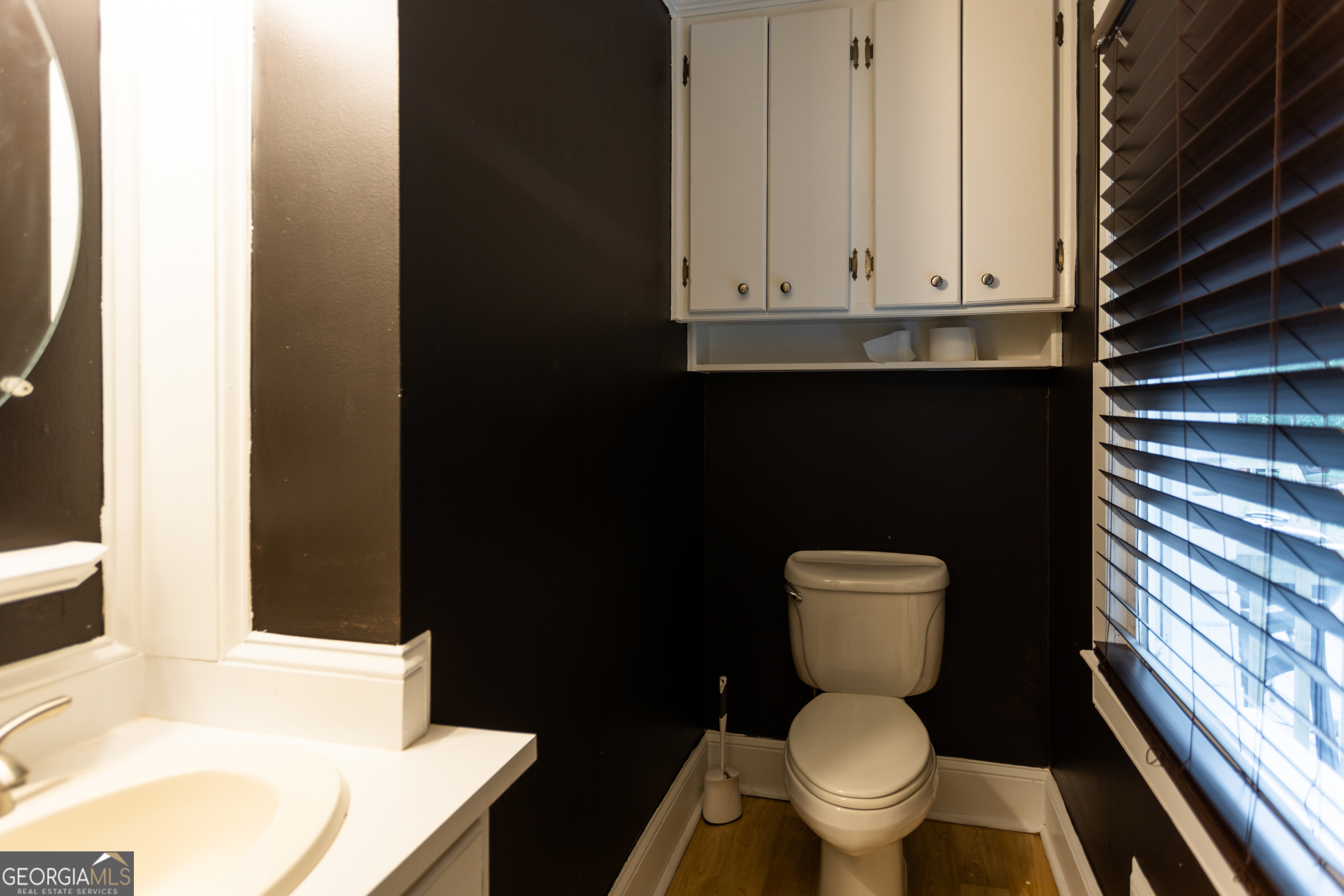 1585 Flat Rock Road Covington, GA 30014 - Photo 29 of 48 a white toilet sitting next to a bathroom sink