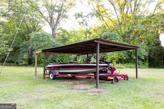 a view of outdoor space with deck and yard