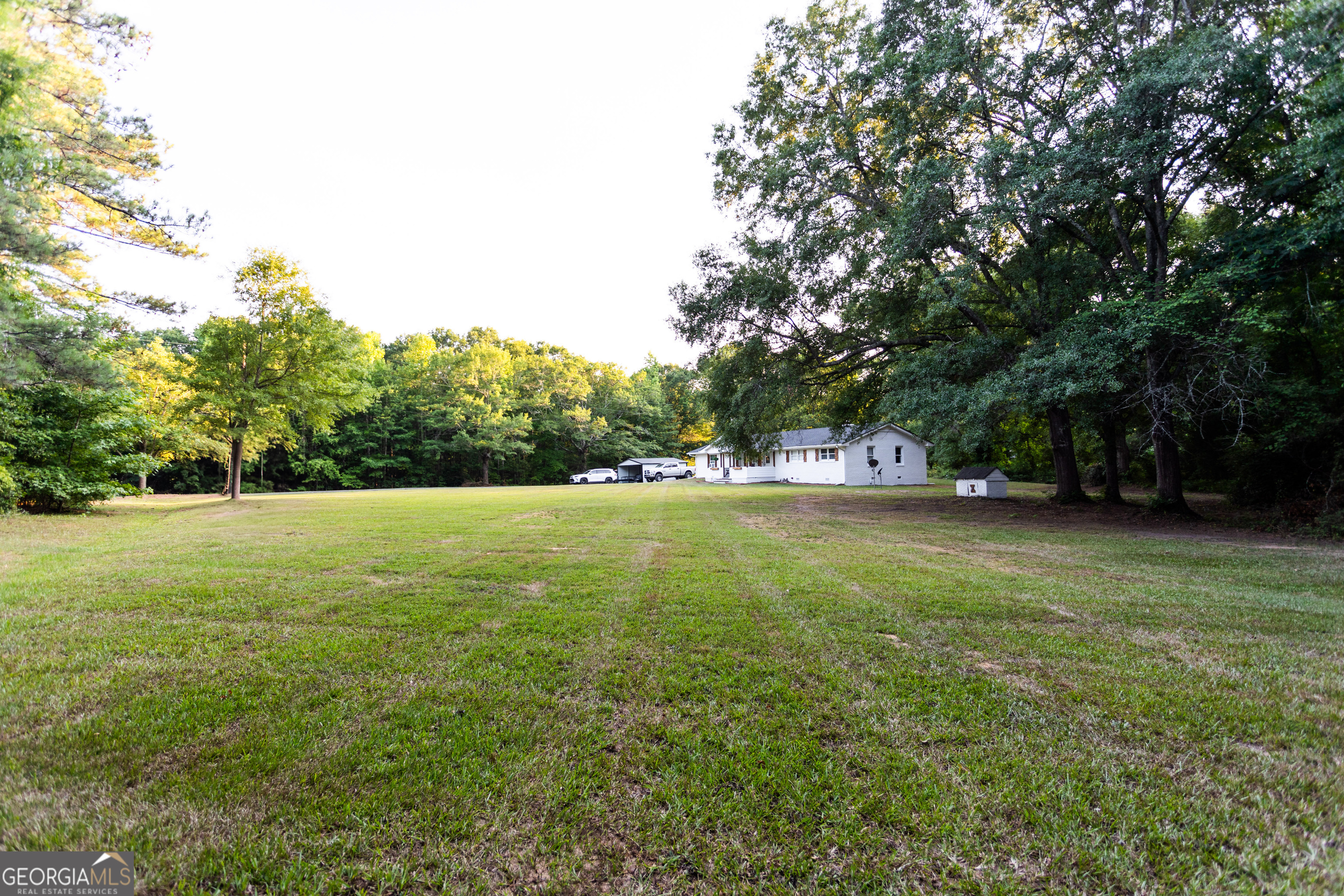 1585 Flat Rock Road Covington, GA 30014 - Photo 41 of 48 a view of outdoor space with deck and yard