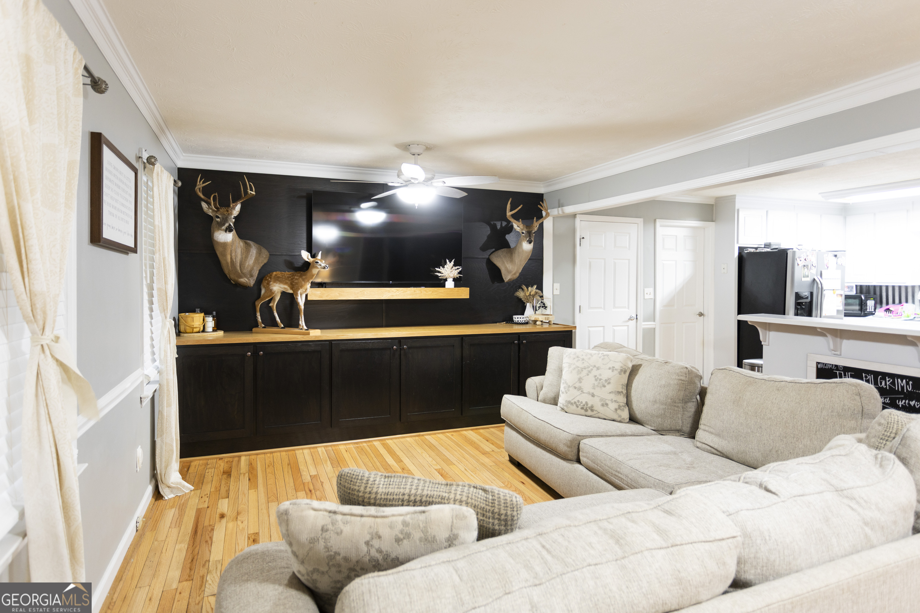 1585 Flat Rock Road Covington, GA 30014 - Photo 5 of 48 a living room with furniture and a flat screen tv