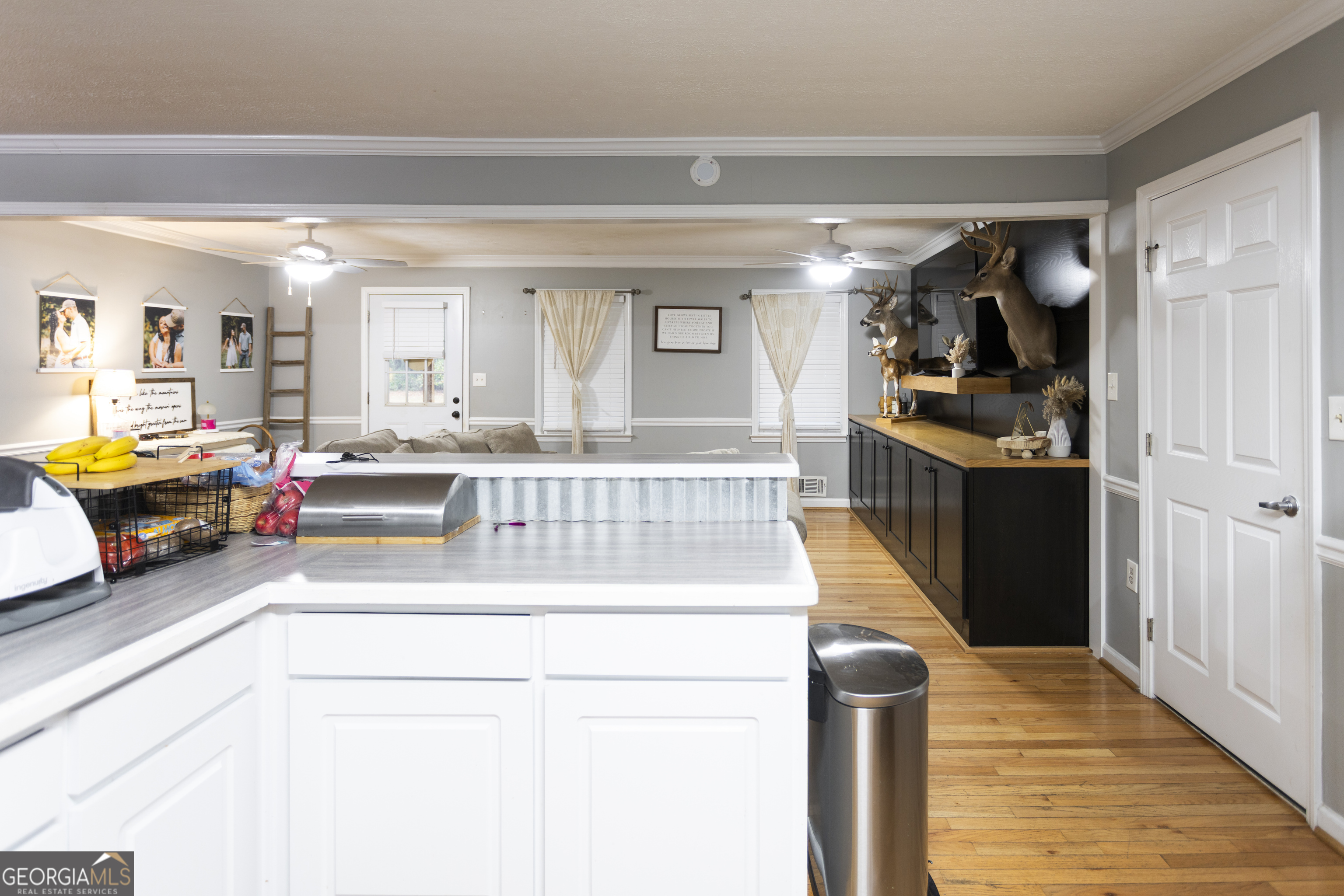 1585 Flat Rock Road Covington, GA 30014 - Photo 7 of 48 a living room with furniture and a wooden floor