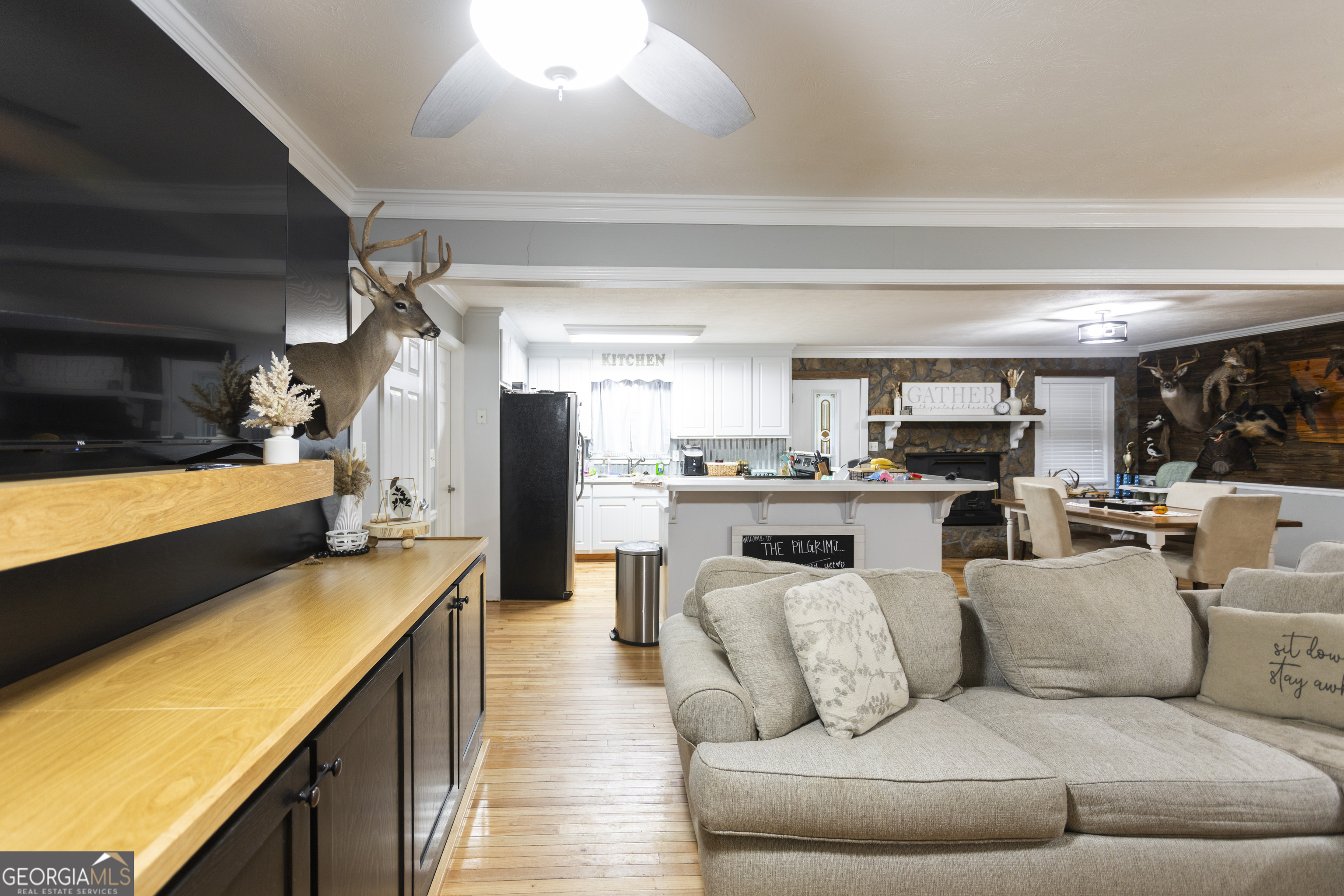 1585 Flat Rock Road Covington, GA 30014 - Photo 9 of 48 a living room with furniture and a flat screen tv