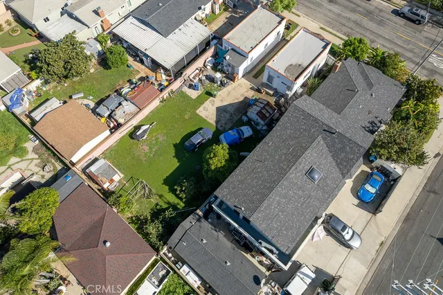 an aerial view of a house with a swimming pool