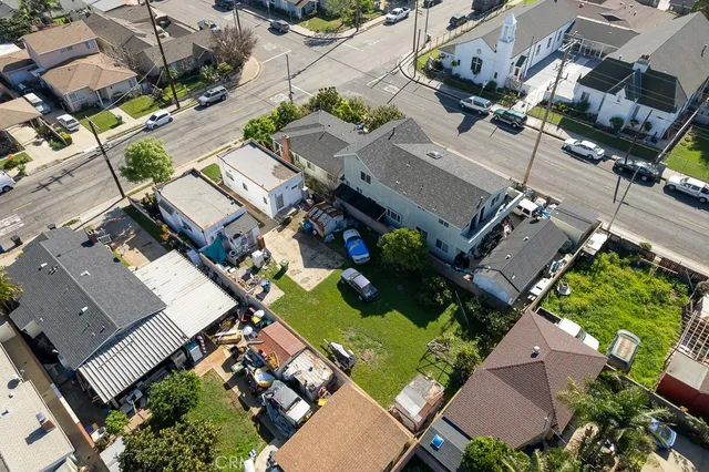 an aerial view of a house with a yard