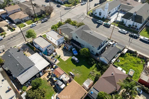 an aerial view of a house with a yard