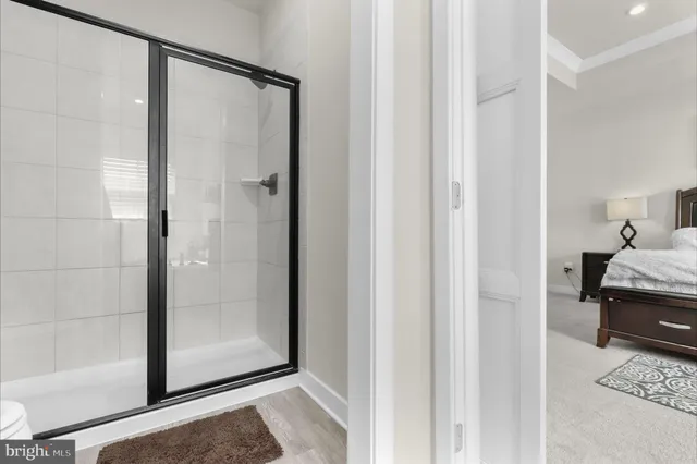 a view of a bathroom with a glass shower door