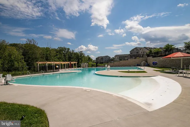 a view of a swimming pool with a yard